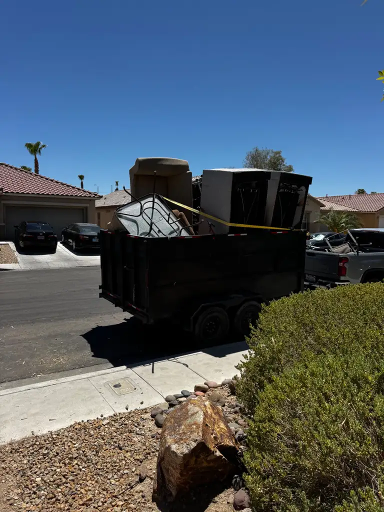 One Stop Junk Removal's trailer loaded with furniture on a Las Vegas street